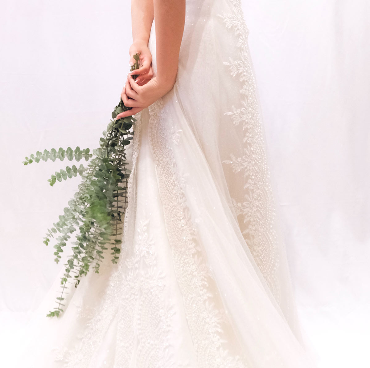 BRIDE-HOLDING-GREENERY bride holding greenery