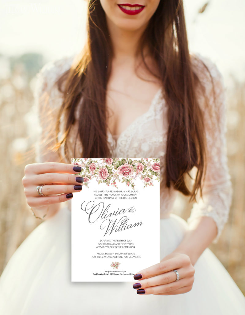 BRIDE-HOLDING-AVA-INVITATION when do i mail out my wedding invitations