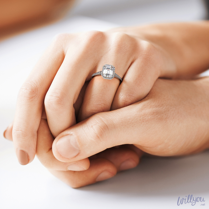 emerald-cut-halo-engagement-ring-in-platinum-hand halo cut
