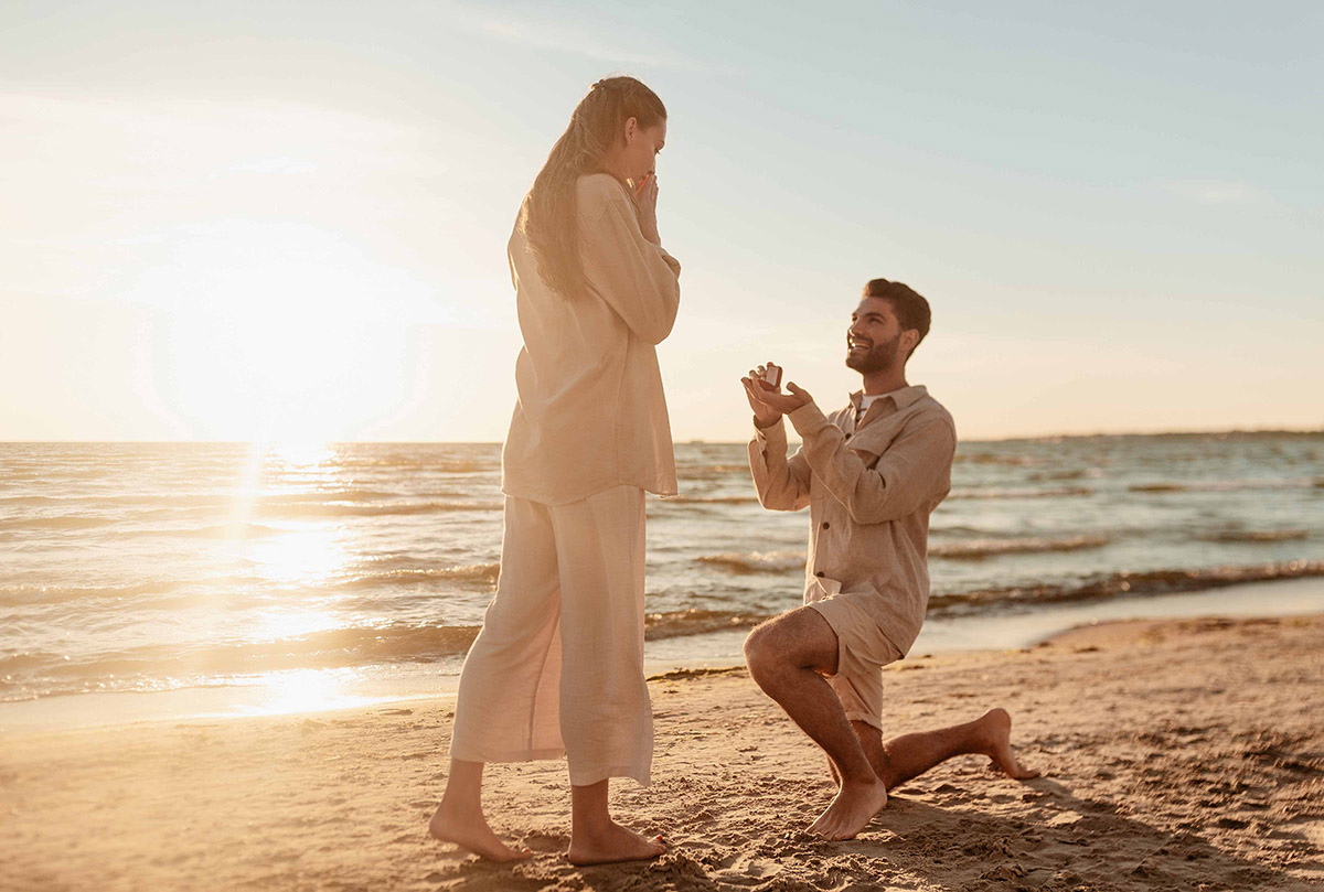 wedding-proposal-and-giving-her-a-pear-shape-diamond wedding proposal with a diamond ring that is pear cut