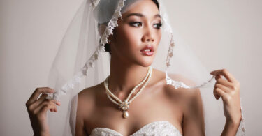 bride wearing pearl necklace