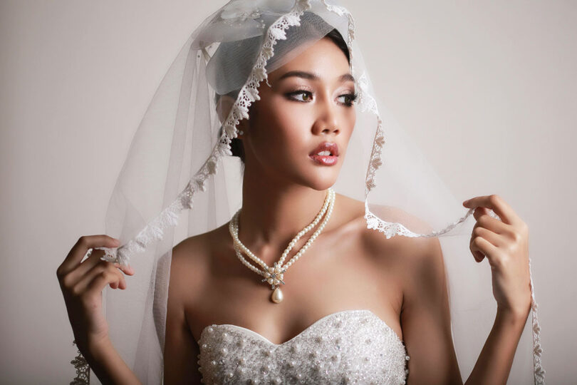bride wearing pearl necklace