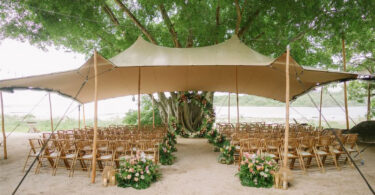 tropical wedding tent ceremony by the beach